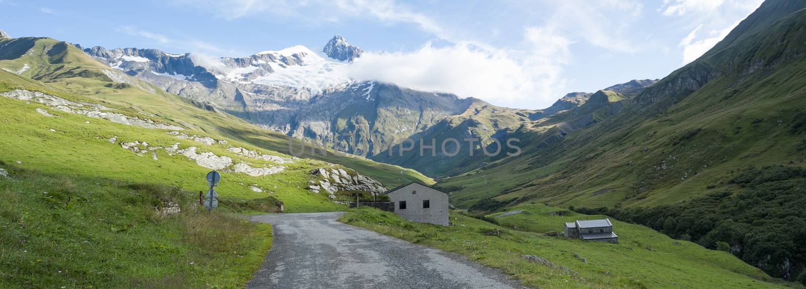 VILLE DES GLACIERS, FRANCE - AUGUST 27: Panoramic of chalets with Glacier Needles. The region is a stage at the Mont Blanc tour, which crosses three countries. August 27, 2014 in Ville des Glaciers.