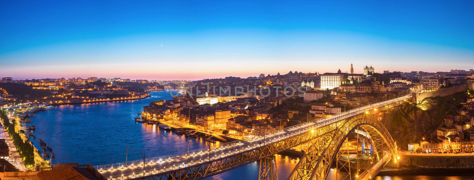 Panorama of Dom Luiz bridge in Porto Portugal at dusk