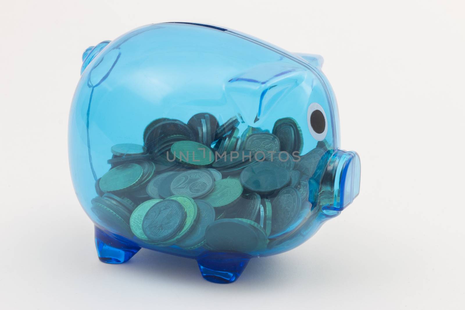 Blue transparent piggy bank with visible euro coins