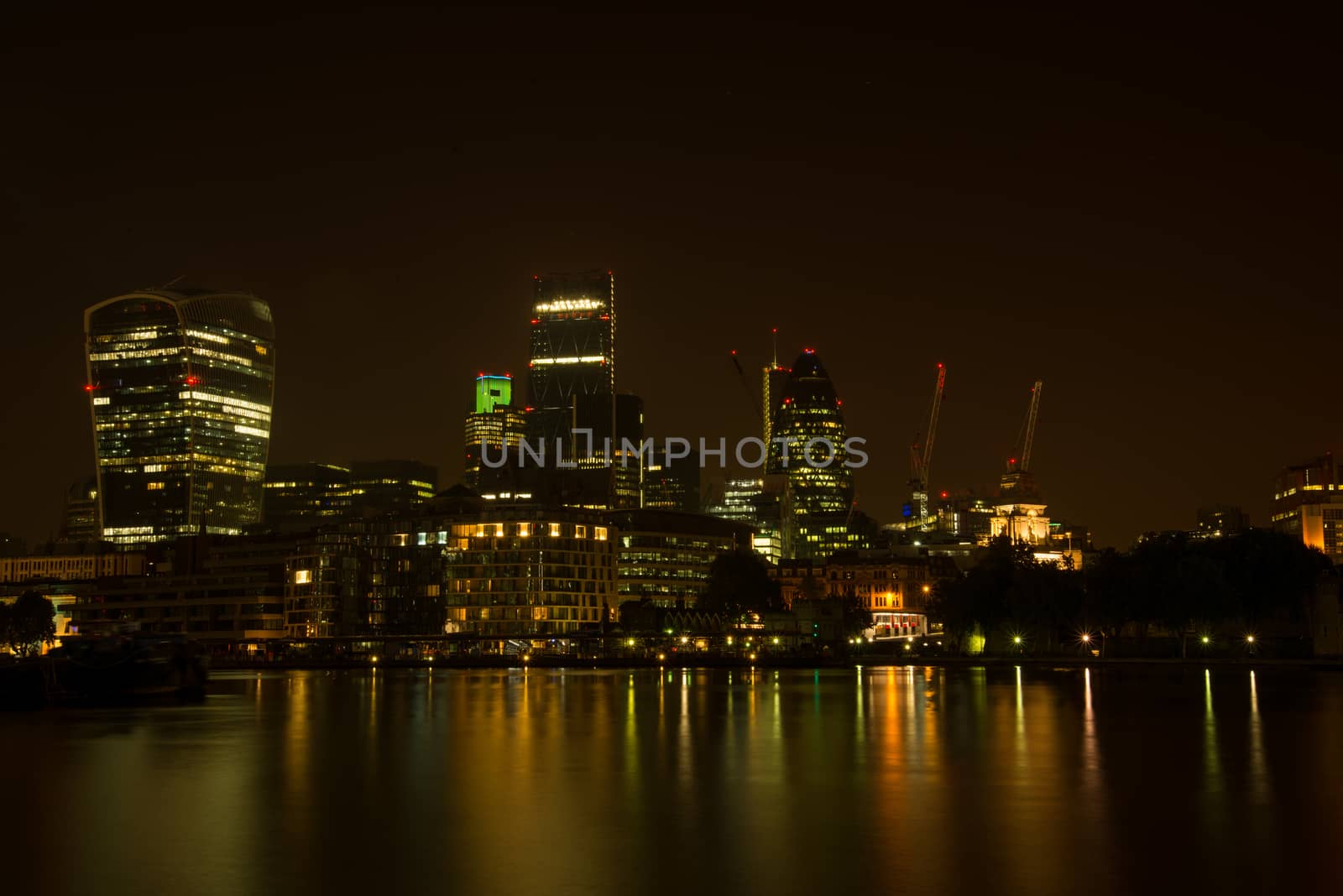 Night view on London bussines skycrapers on Thames bank in Southwark