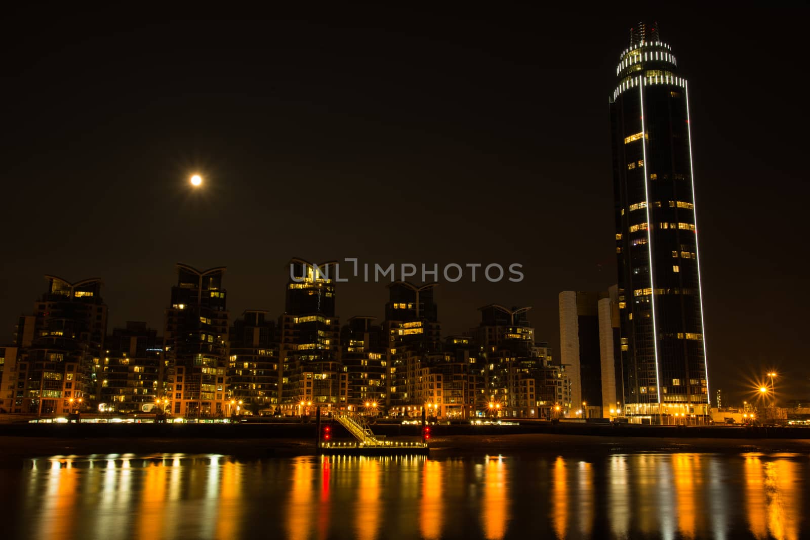 Night view on London bussines skycrapers on Thames bank in Southwark