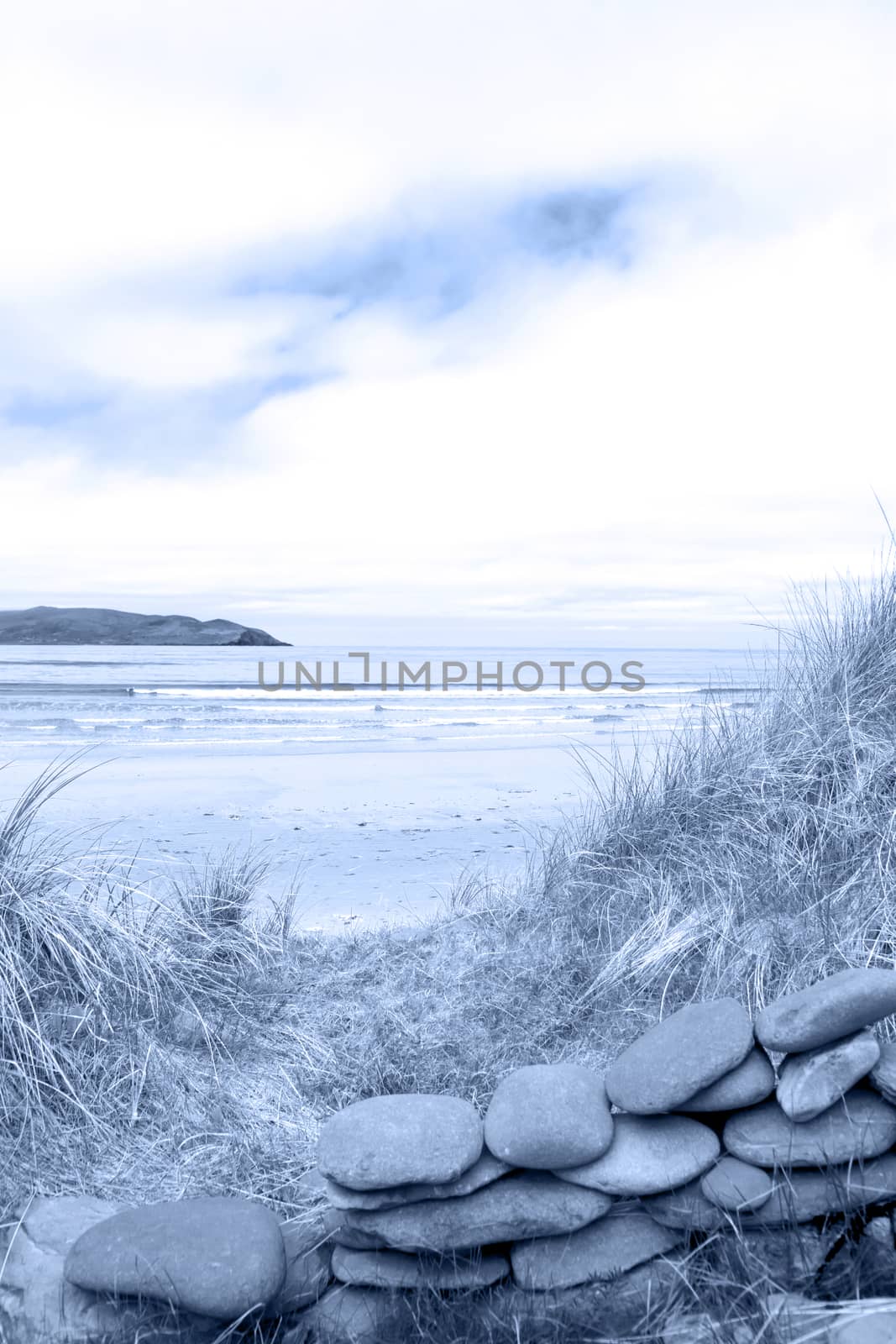 blue toned stone wall shelter on a beautiful beach in the maharees county Kerry Ireland