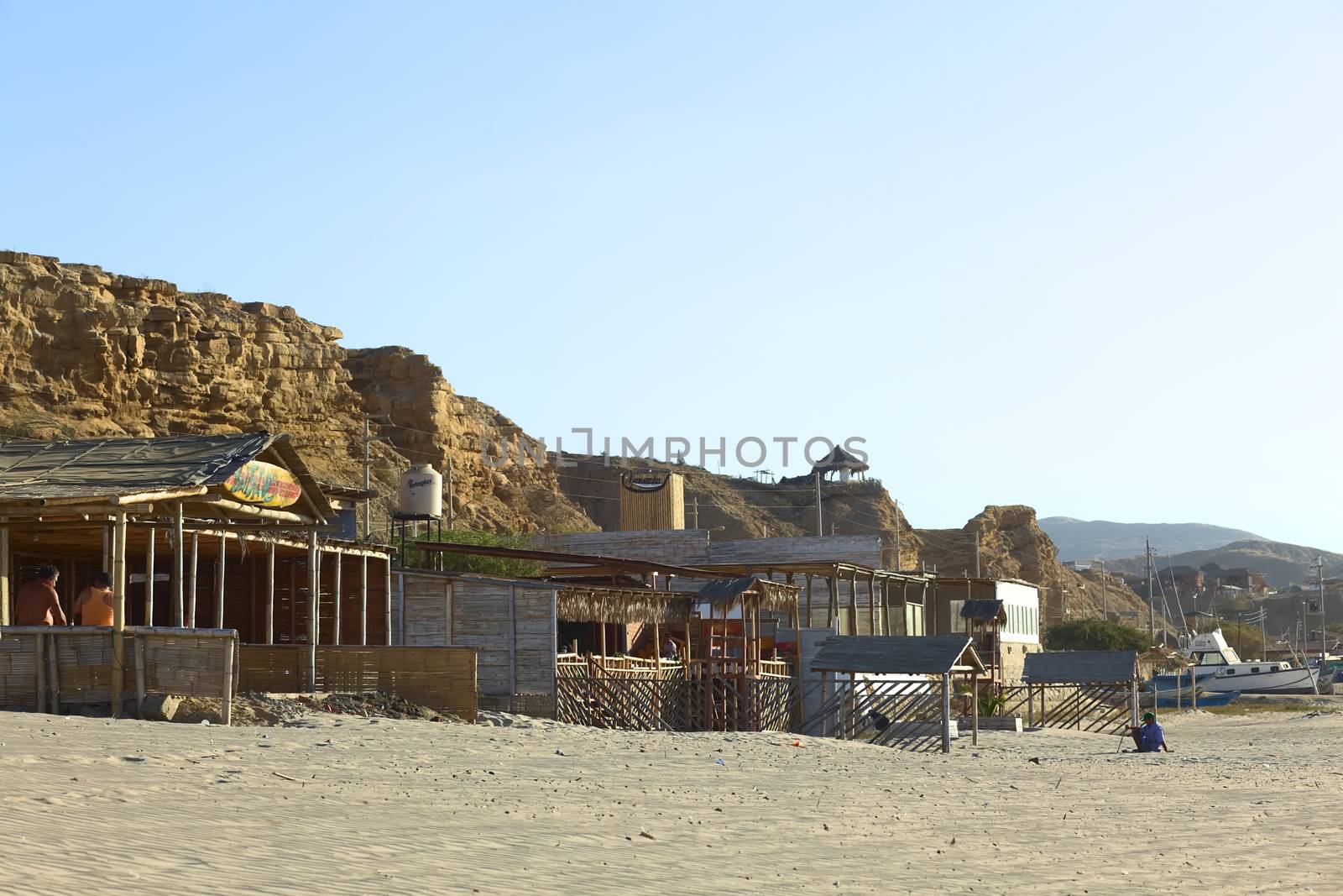 LOS ORGANOS, PERU - AUGUST 30, 2013: Bufalos Bar and Venezia Restaurant Hospedaje (Hostel) along the sandy beach on August 30, 2013 in Los Organos, Peru. Los Organos is a small beach town in Northern Peru, close to the touristy small town of Mancora. 