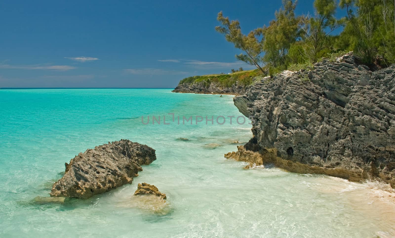 Tropical sea and coastal rocks on a very sunny day