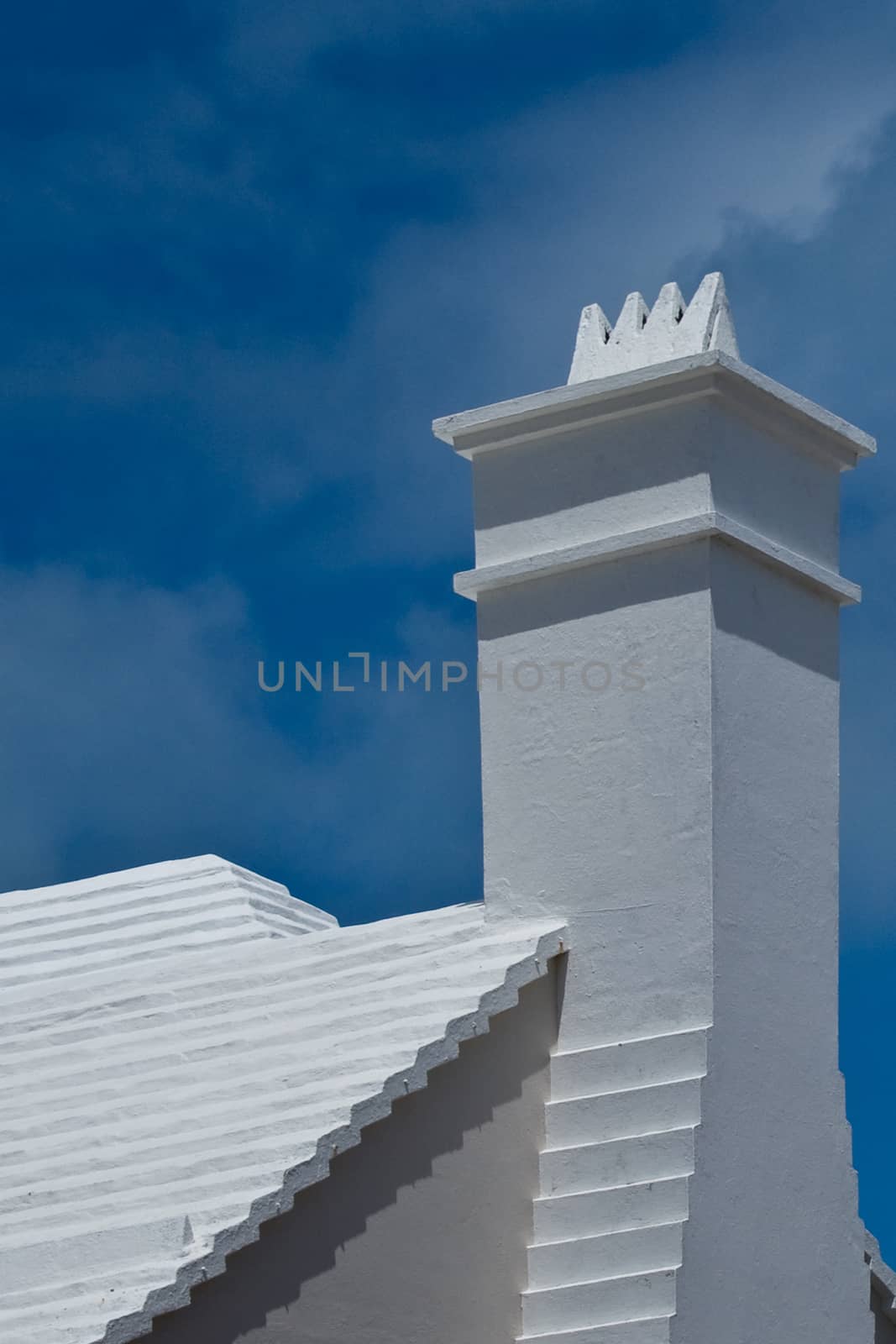 A typical Bermuda chimney set against a blue sky