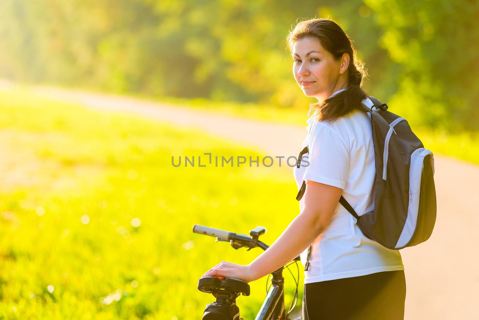 beautiful athlete with a backpack on a bicycle by kosmsos111