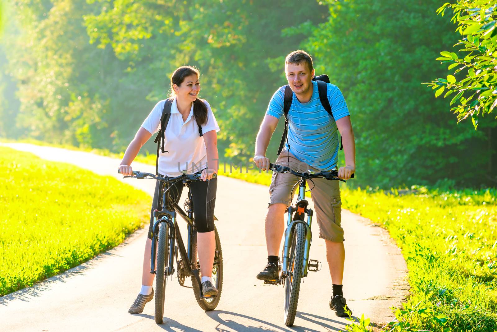 couple with bicycles in the park