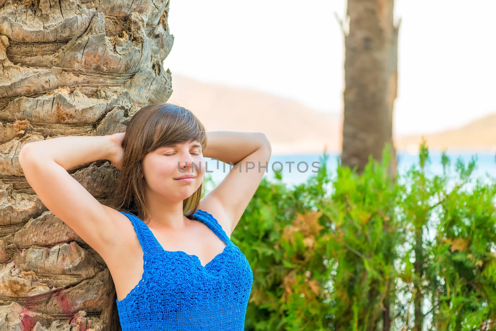 beautiful young woman enjoying the evening at the sea by kosmsos111