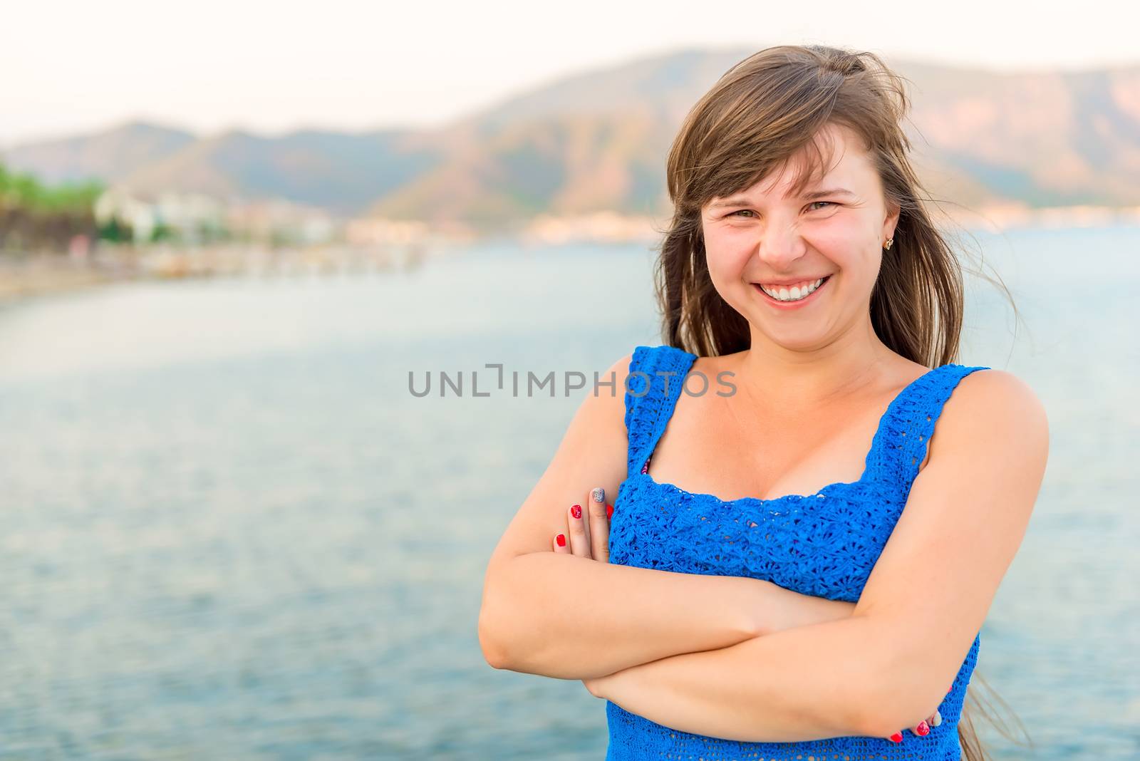 beautiful young girl laughing on the sea background by kosmsos111