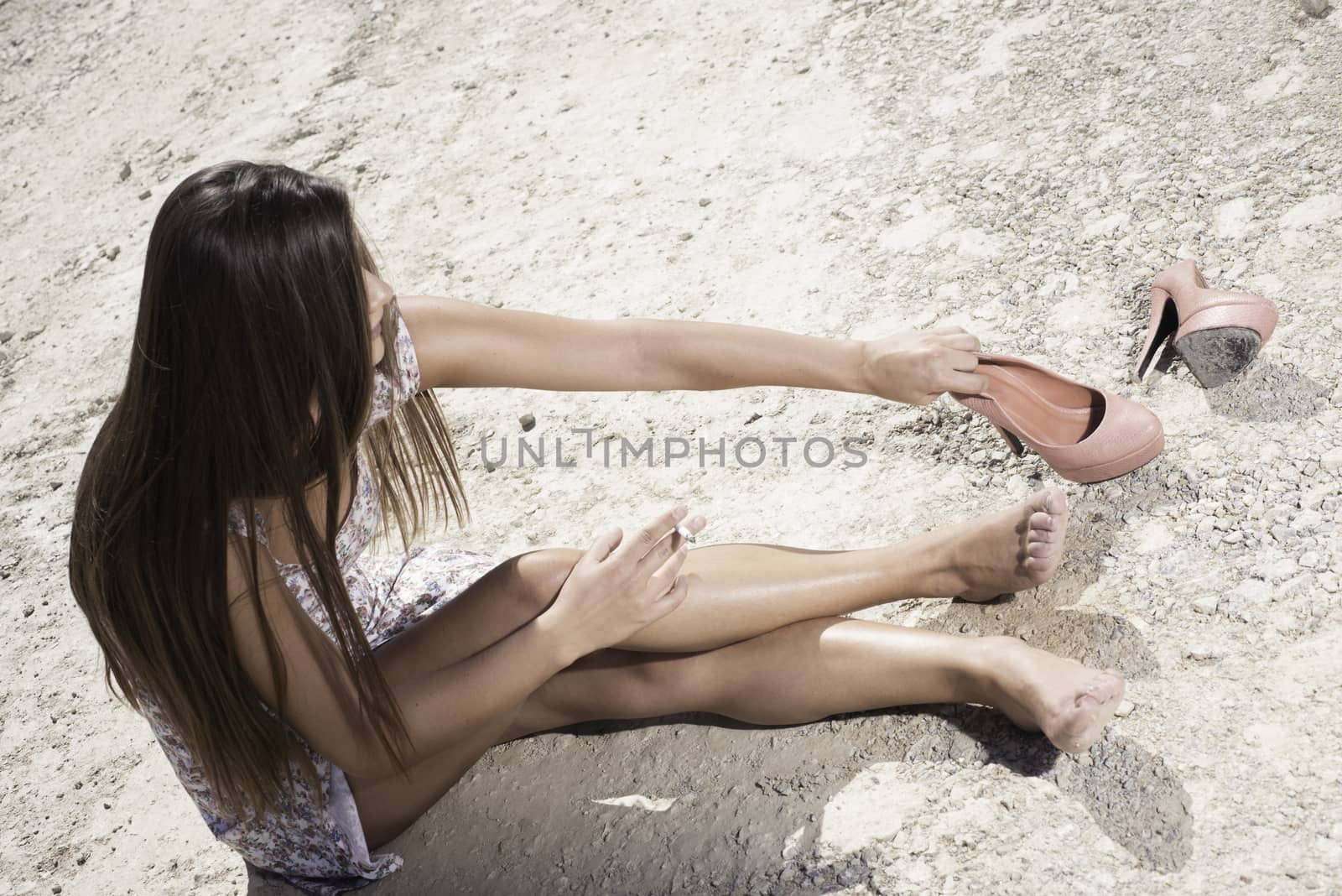 Lady in summer dress relaxing on a sunny day