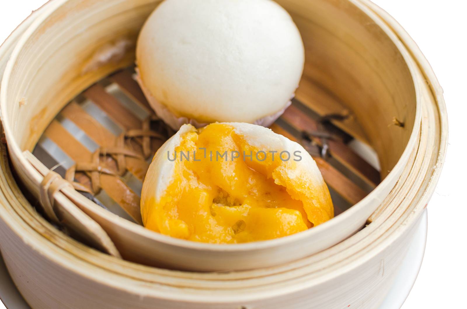 Close up Dim Sum in Bamboo Steamed Bow on white background by nopparats
