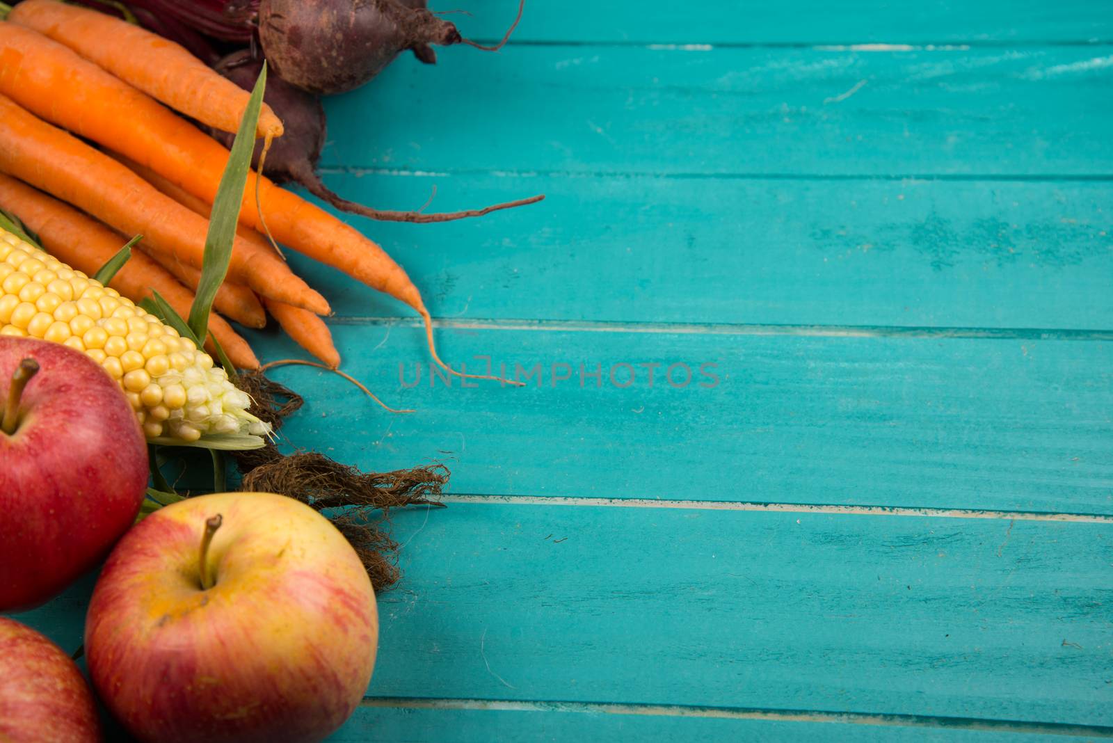 Farm fresh organic vegetables on rustic wooden blue table background