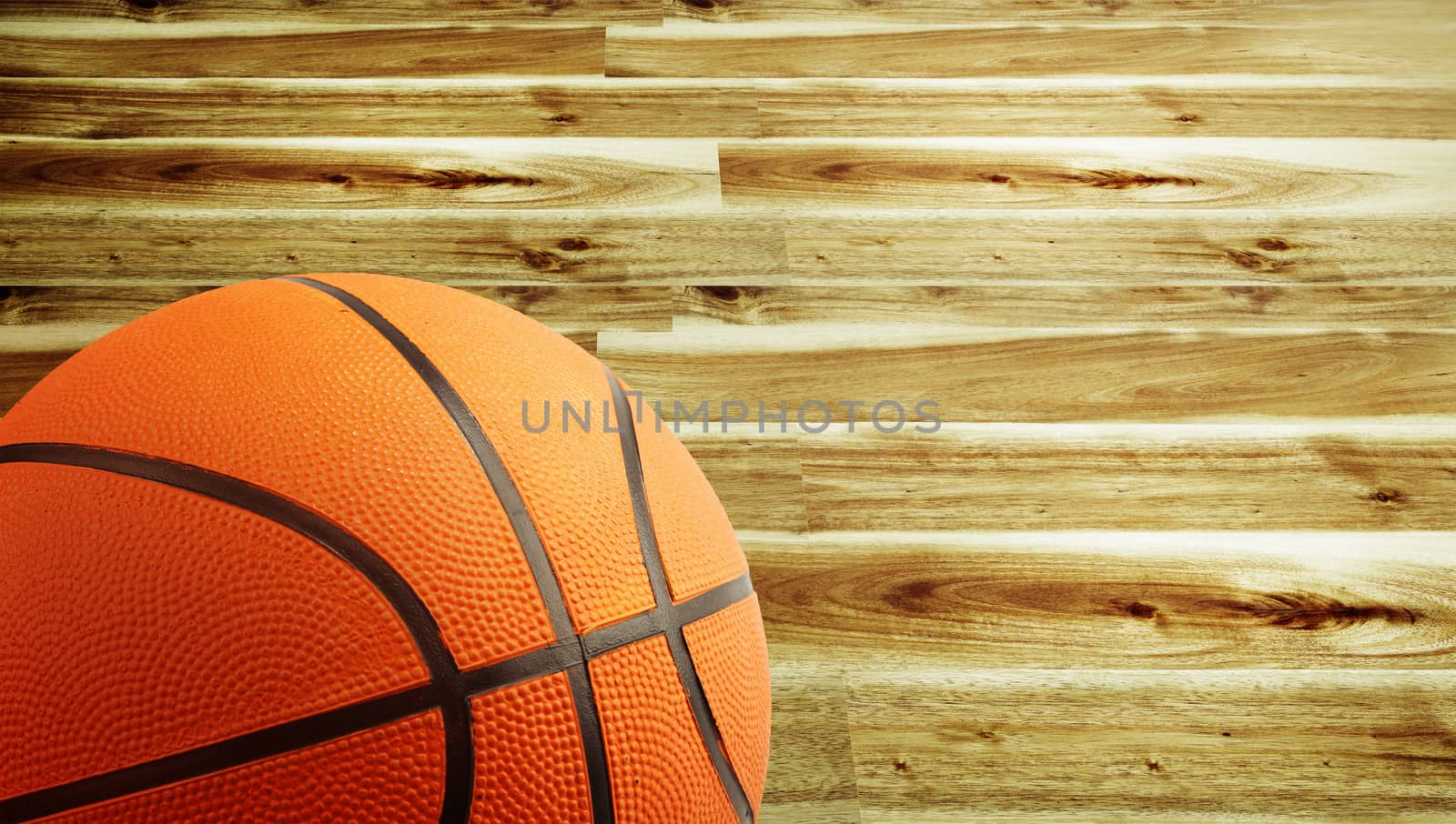 Closeup of a basketball and wooden floor