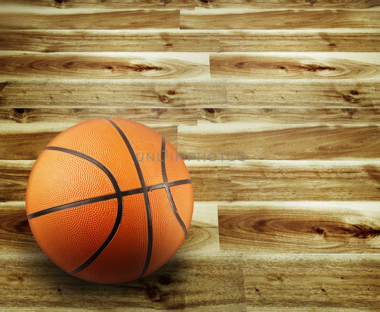 Closeup of a basketball and wooden floor