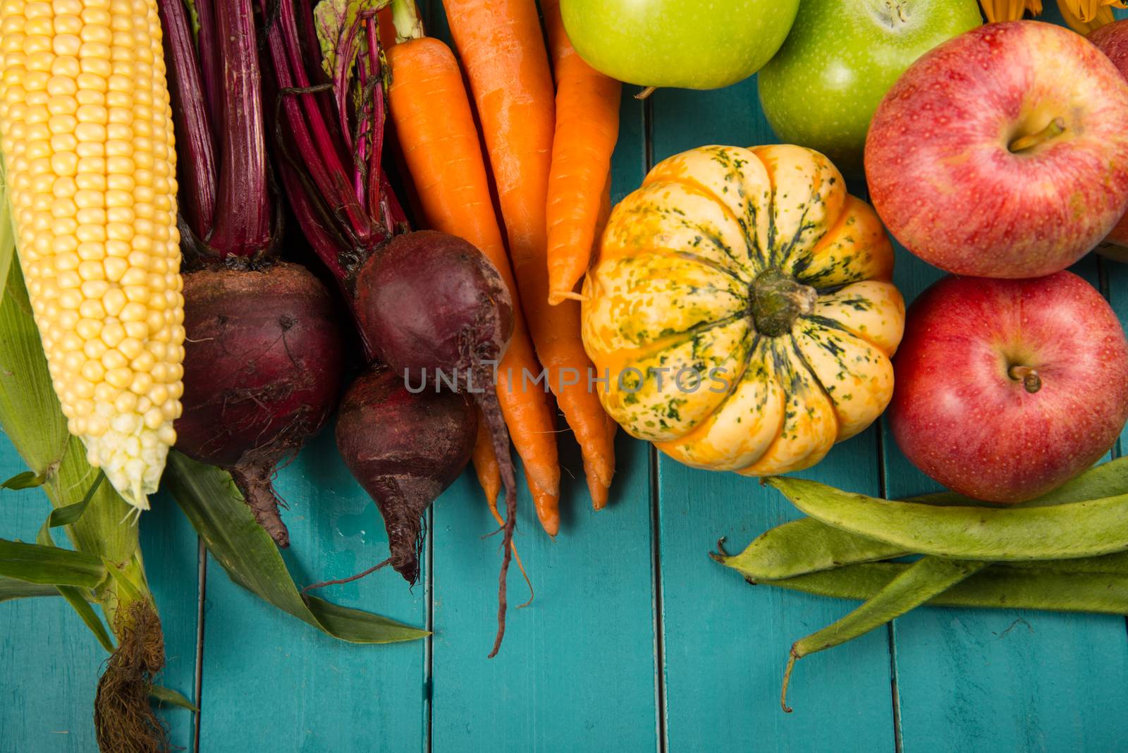 Farm fresh organic vegetables on rustic wooden blue table background