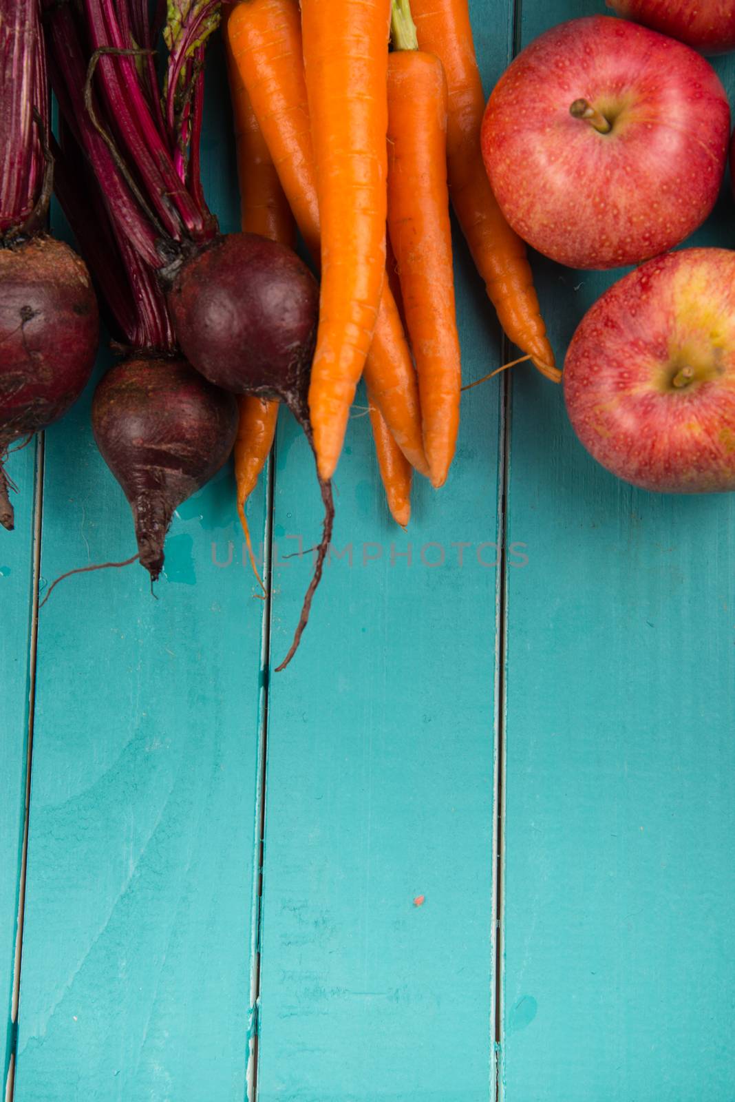 Farm fresh organic vegetables on rustic wooden blue table background