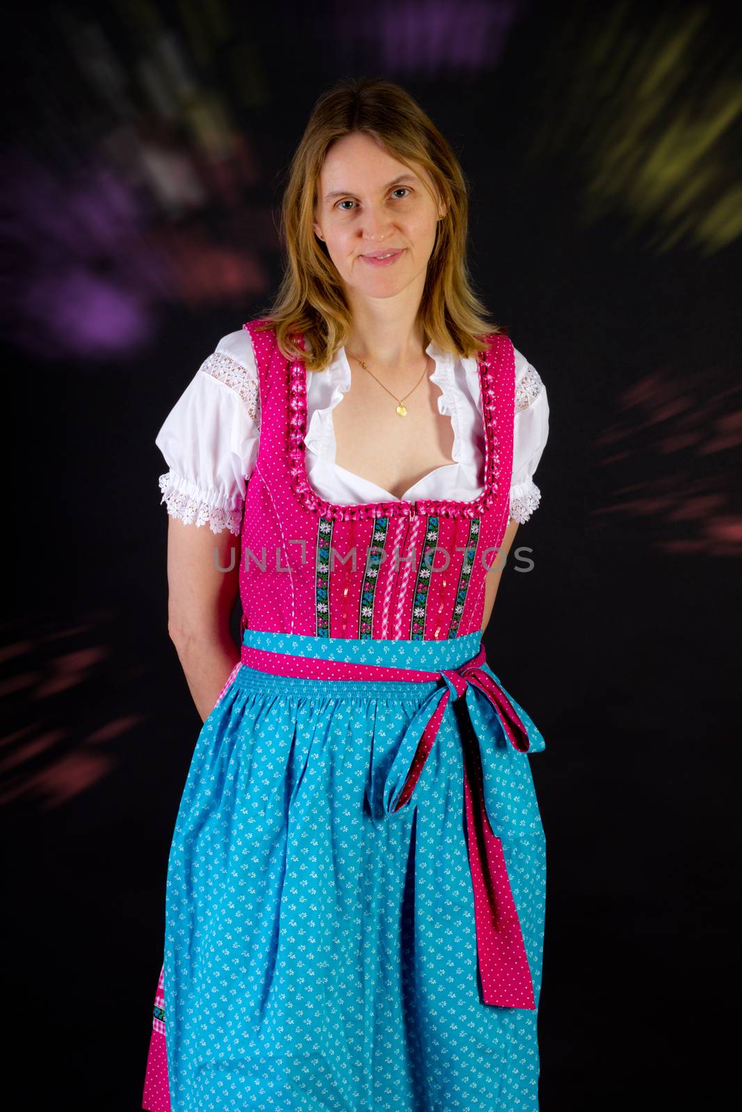 Woman in dirndl at Oktoberfest by gwolters