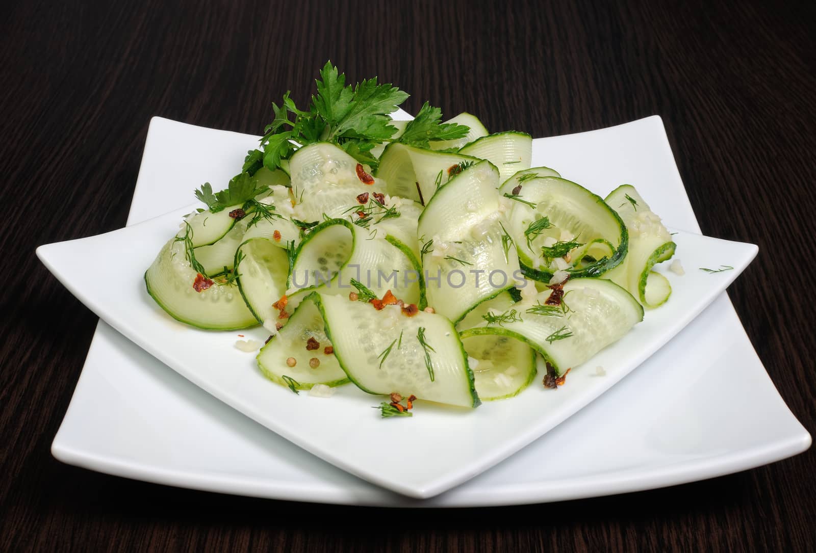 Acute appetizer of fresh cucumbers with garlic, dill, spices
