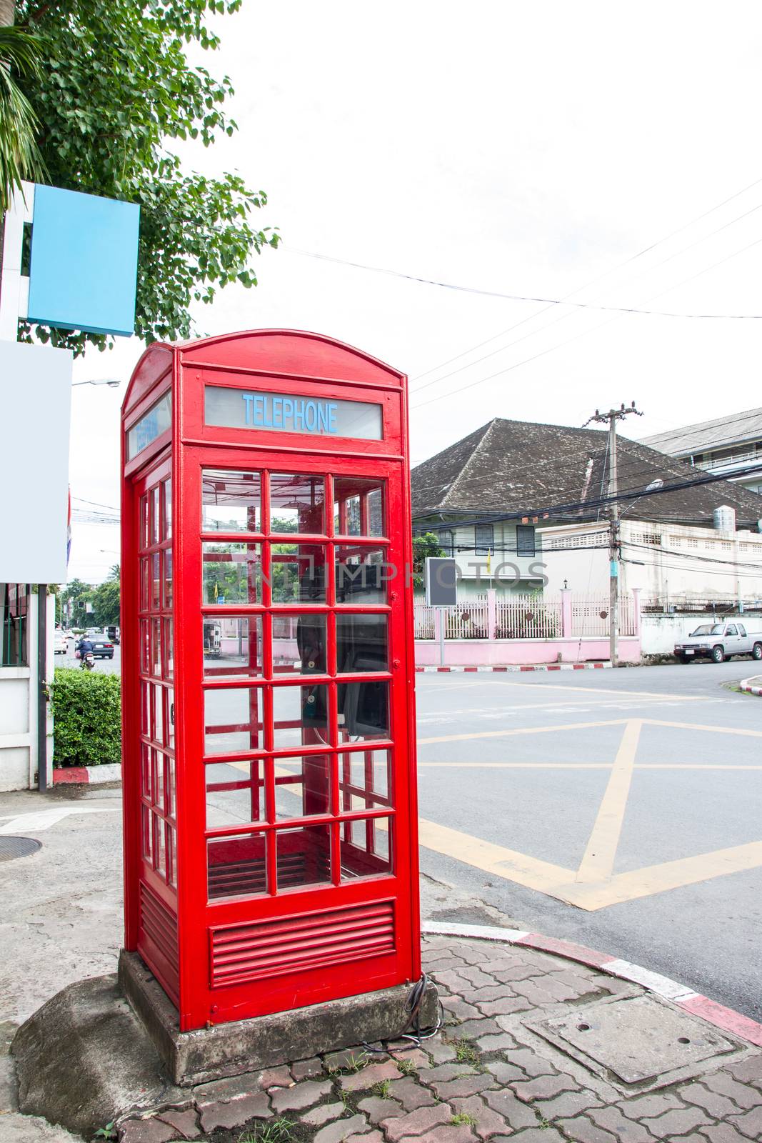red phone booth in Chiang Mai, Thailand by kasinv