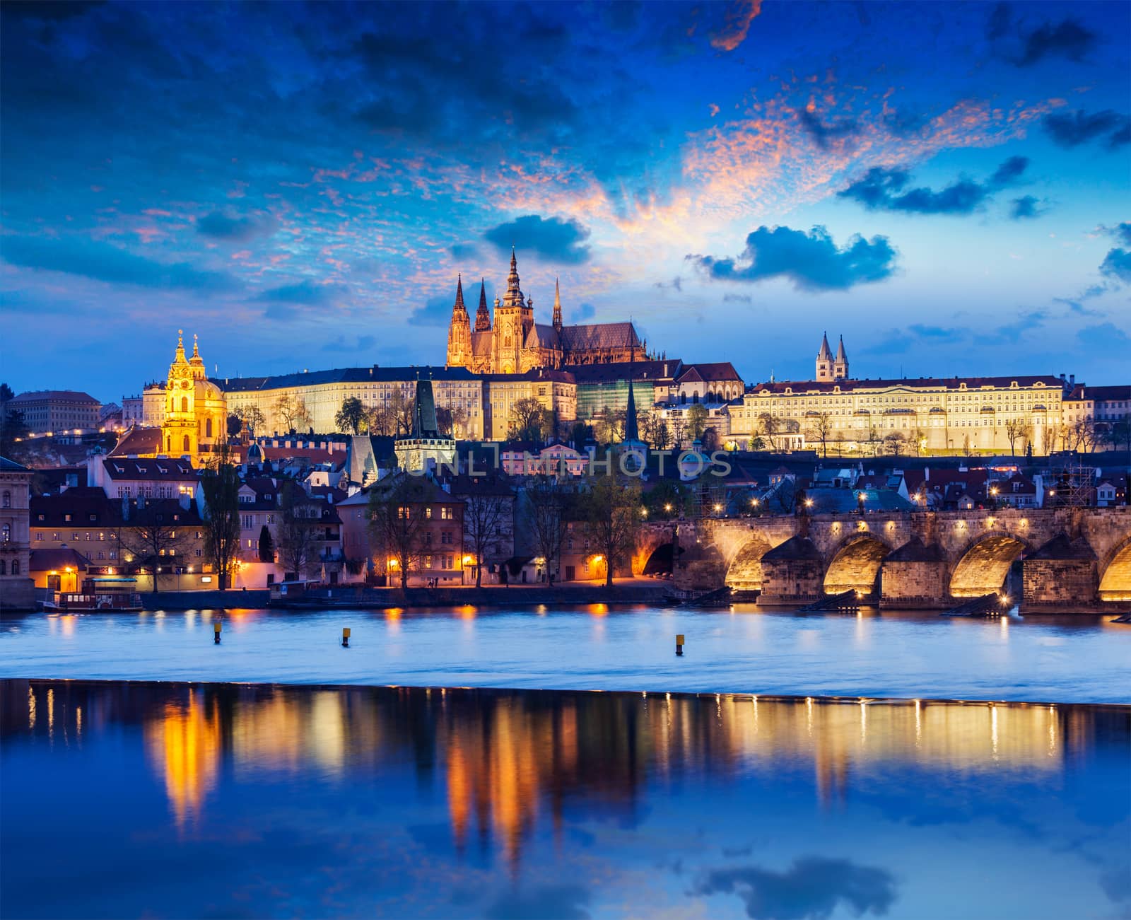 Travel Prague Europe concept background - view of Charles Bridge and Prague Castle in twilight. Prague, Czech Republic