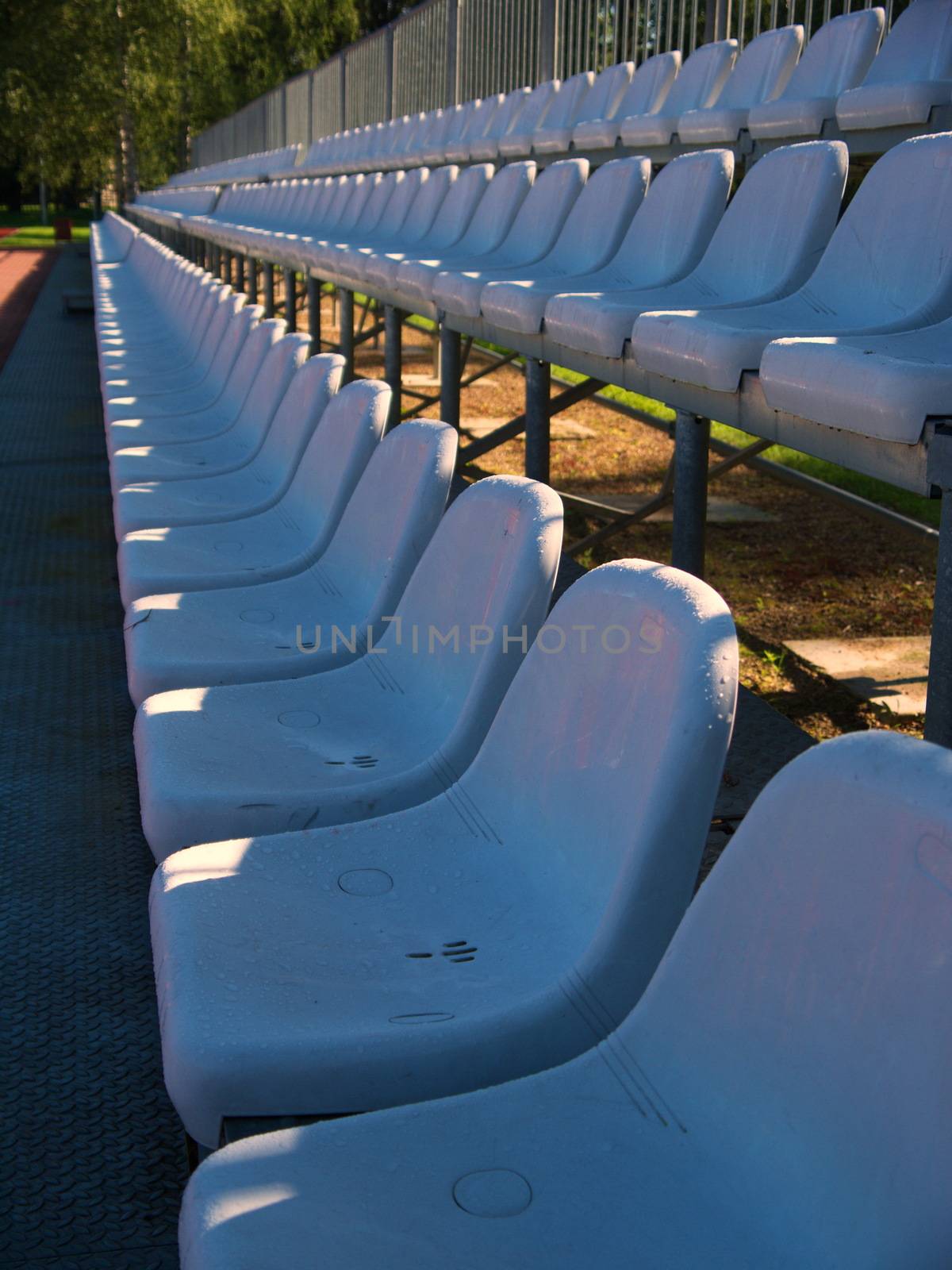 Rows of chairs in a stadium by dolfinvik