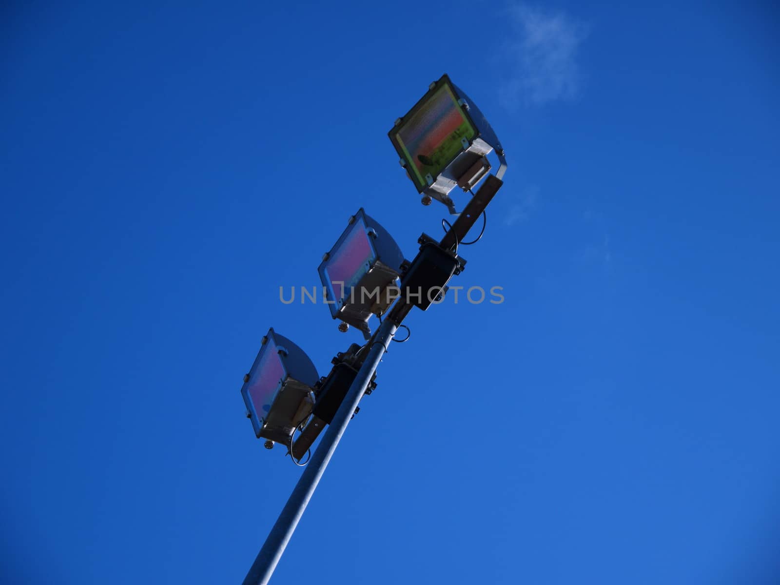 Stadium light against blue sky in Riga