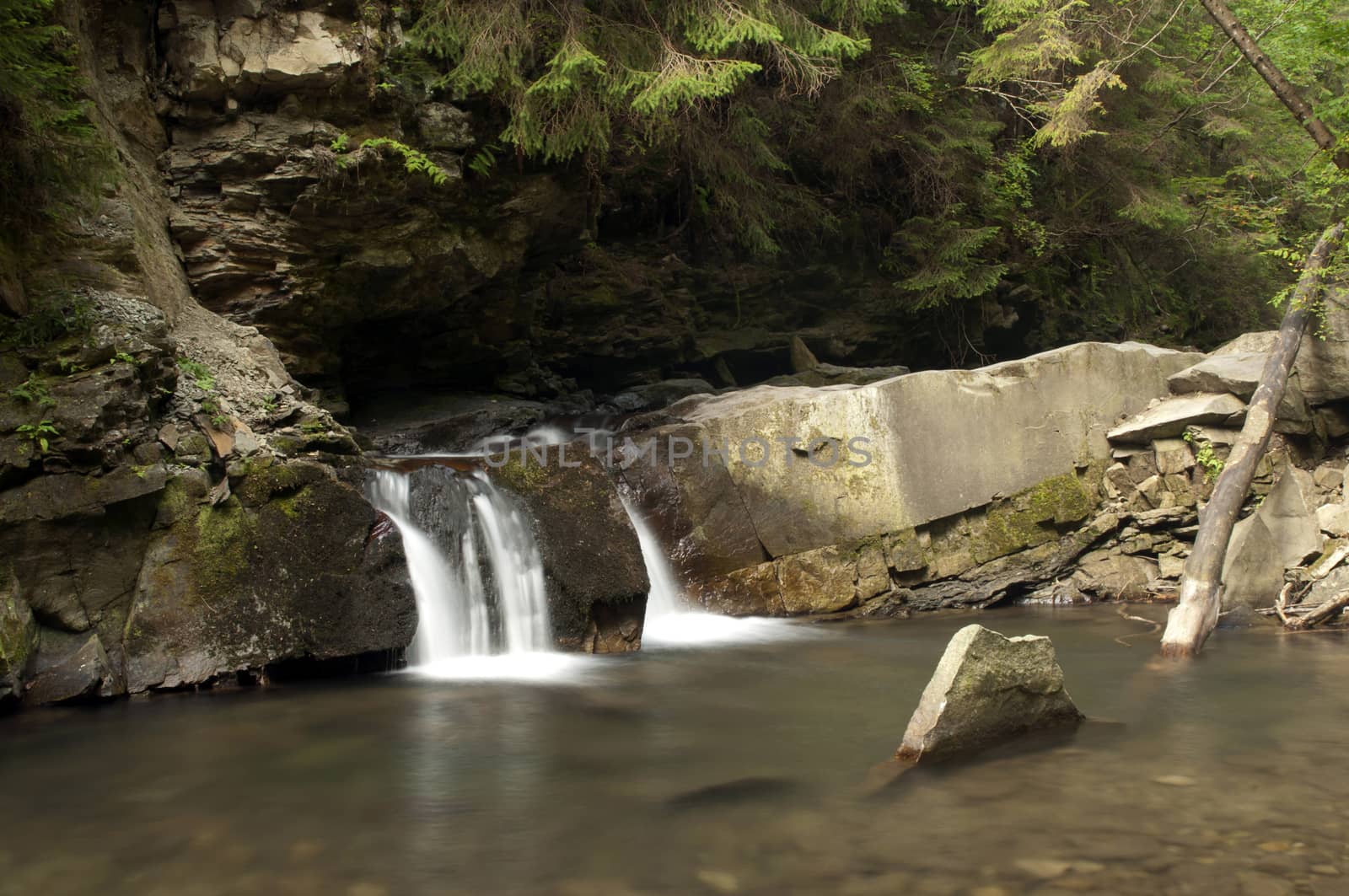 Small waterfall Divochi Sliozy on the Zhonka river in Yaremche, Ivano-Frankivsk region, Ukraine