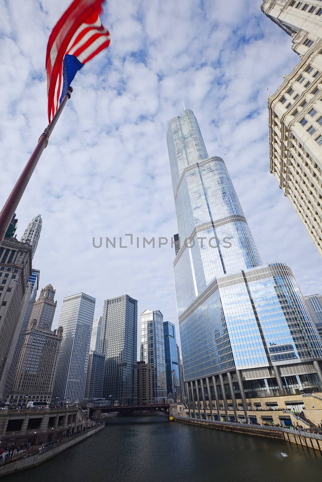 tall buildings in chicago, illinois with american flag