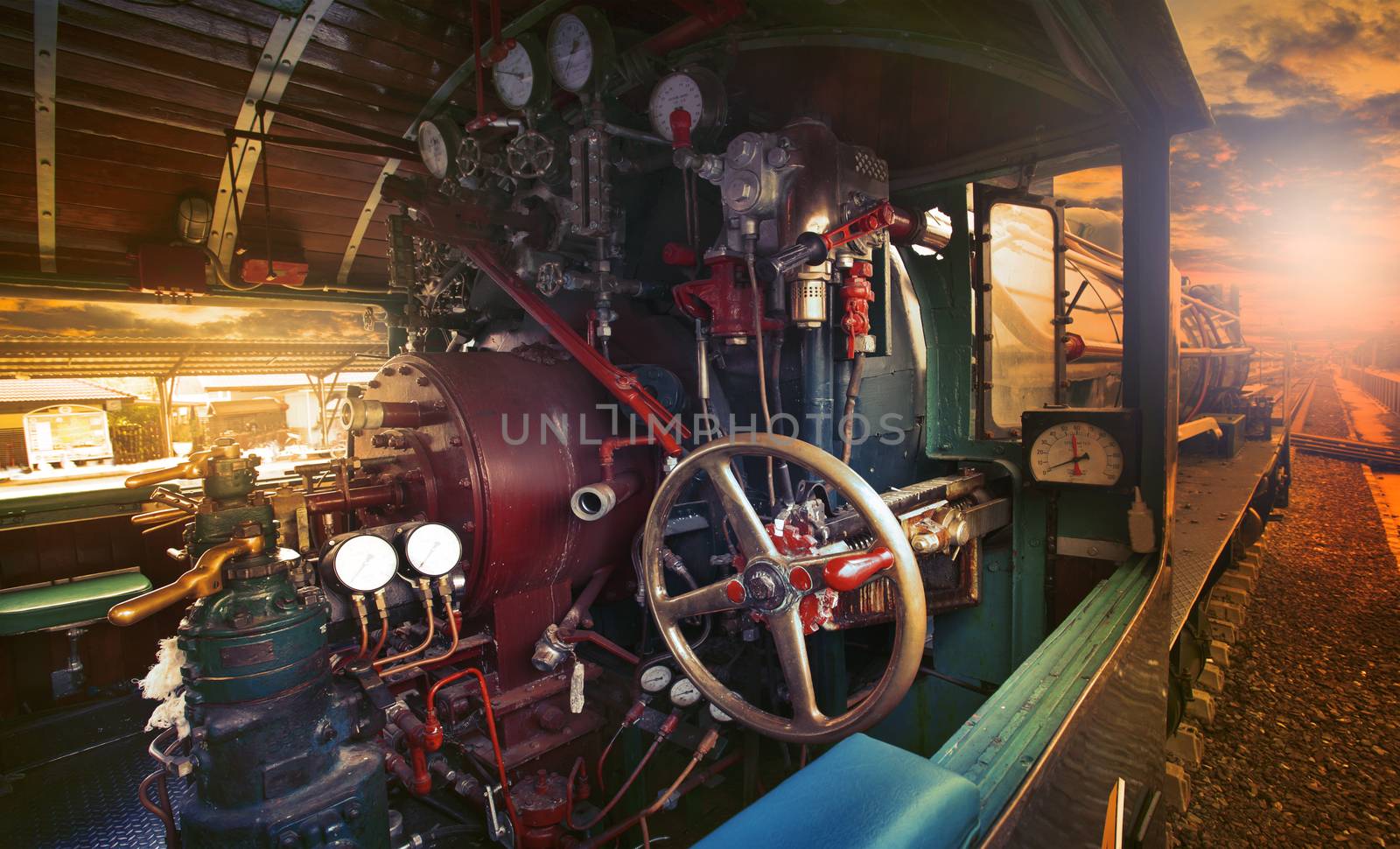 inside control room of stream engine locomotive train parking on by khunaspix