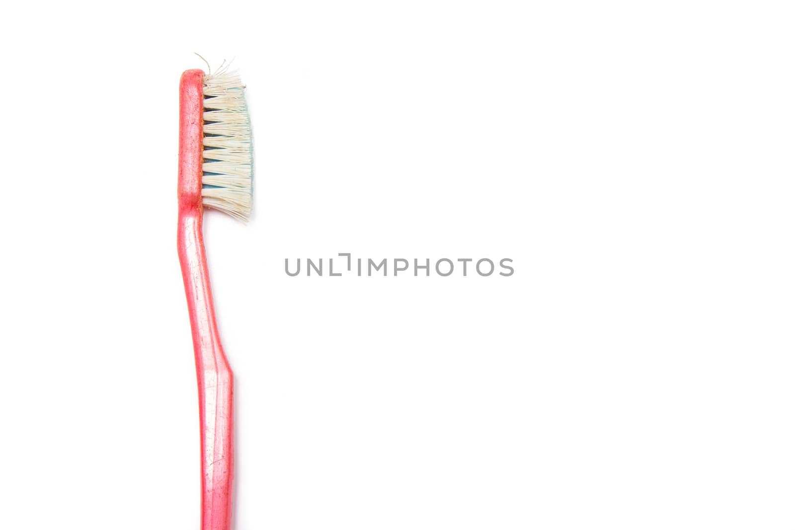 old toothbrush isolated on white background
