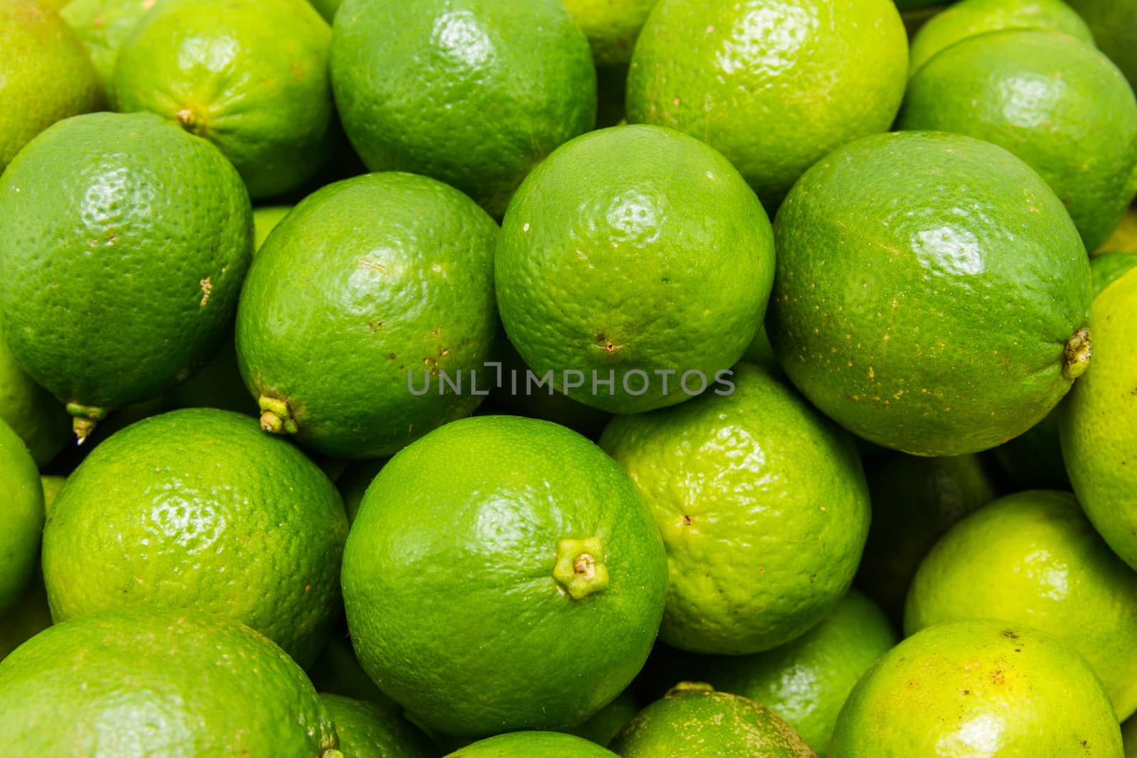 close up view of green lime citrus fruit