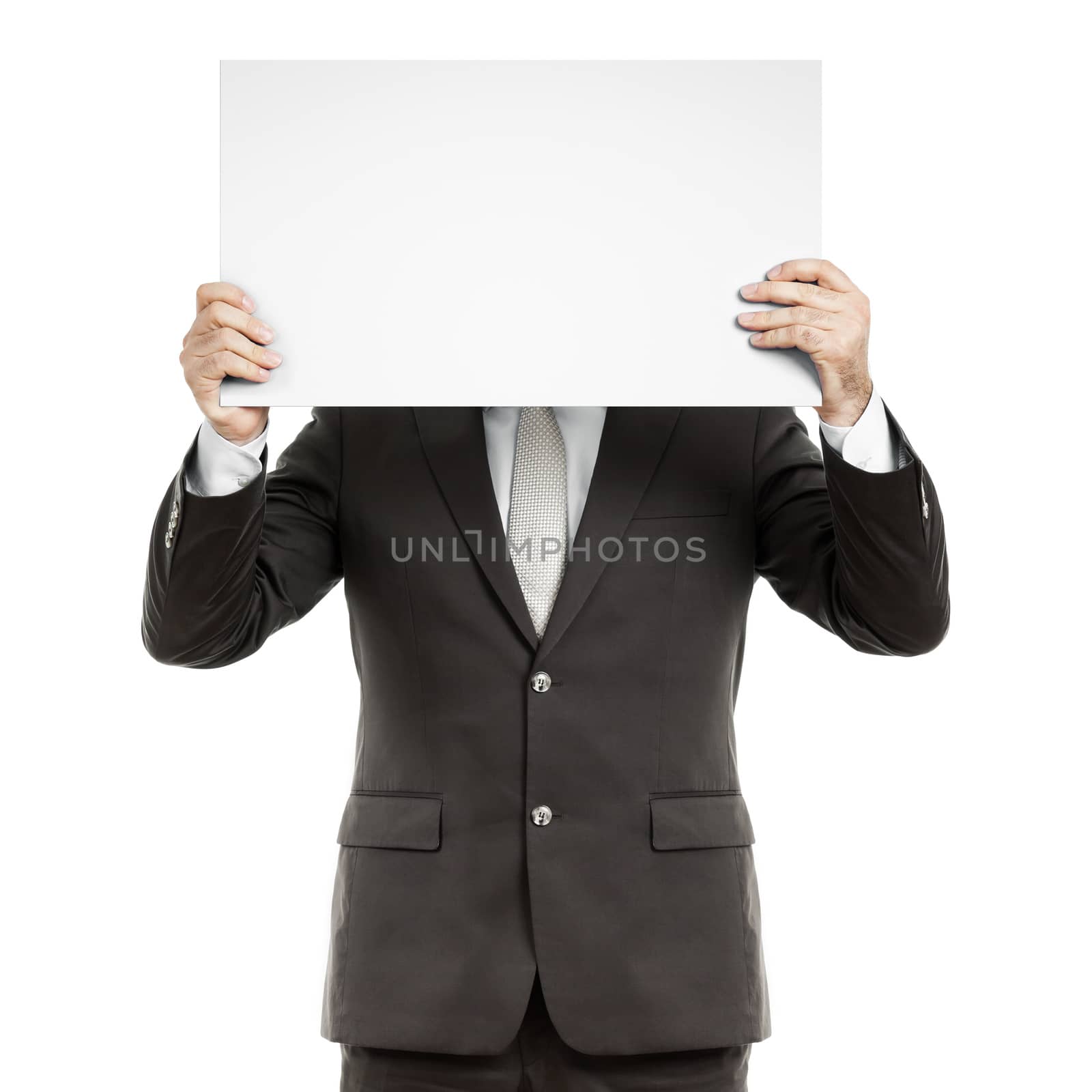 A business man holding a blank paper in front of his face
