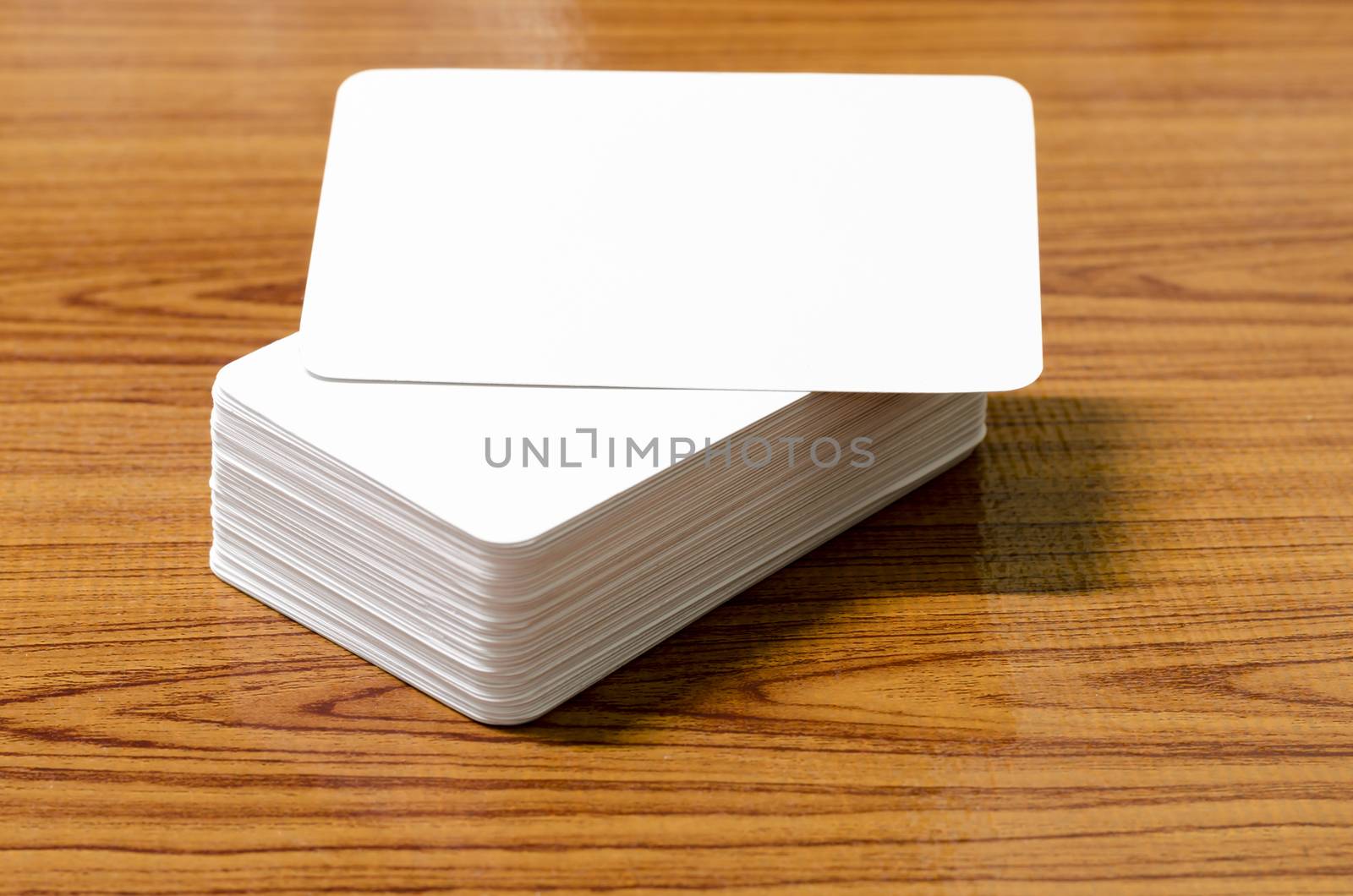 stack of business card on wood background