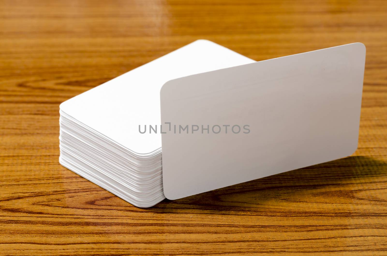 stack of business card on wood background