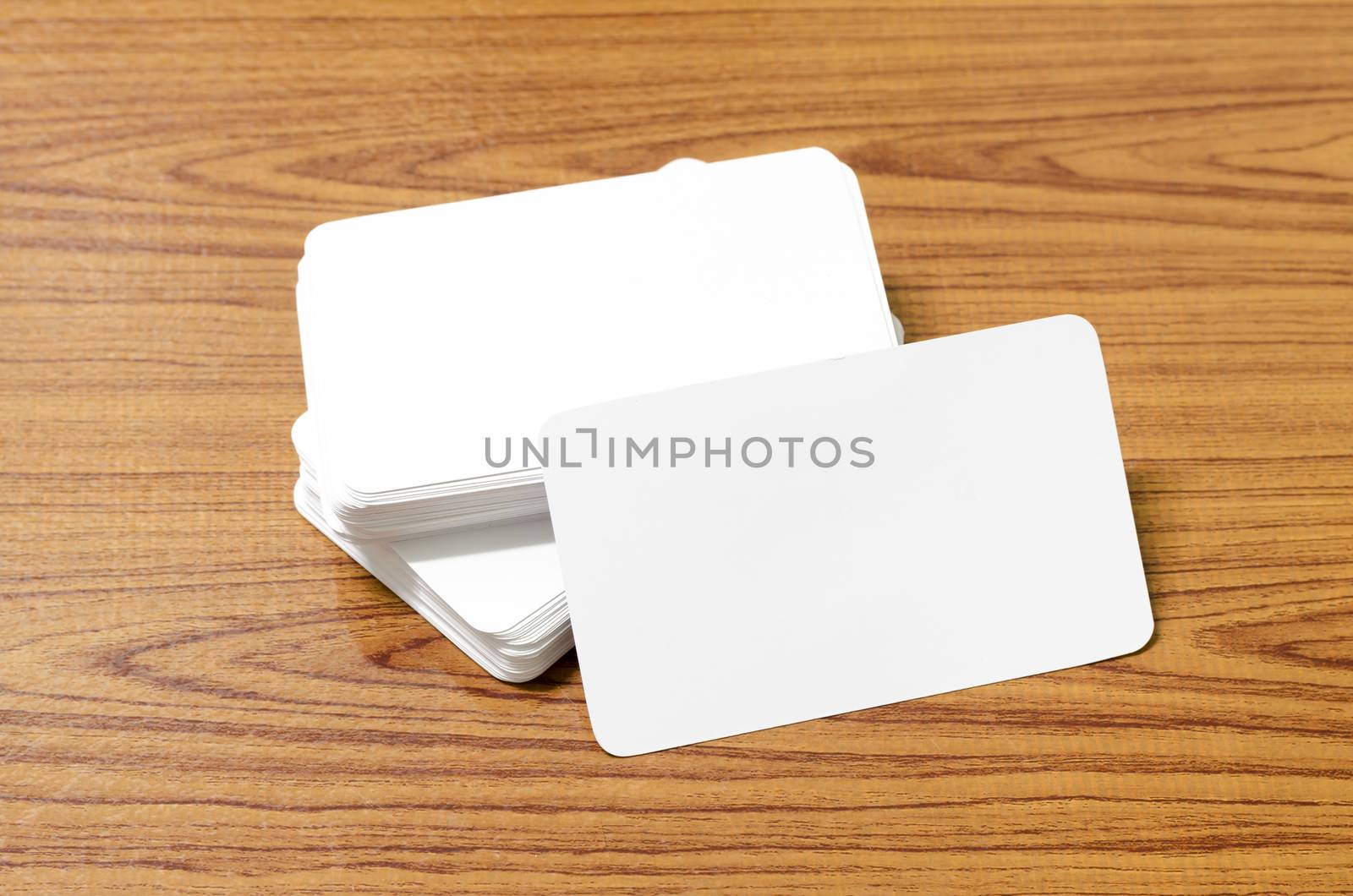 stack of business card on wood background