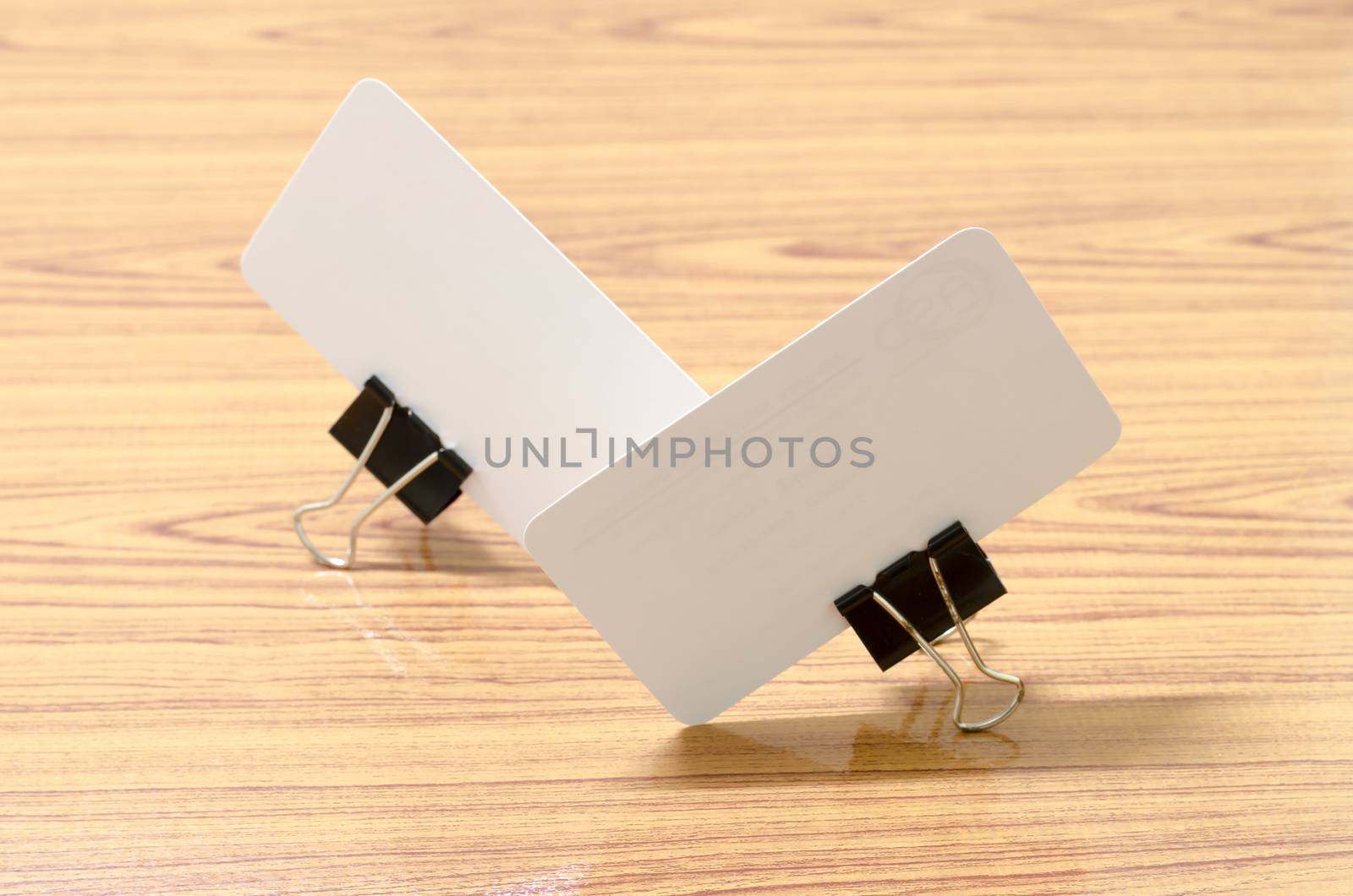 card and clip design on wood background