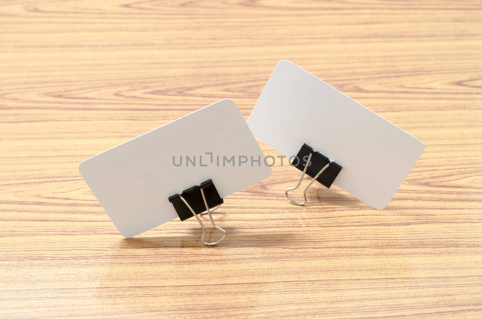 card and clip design on wood background