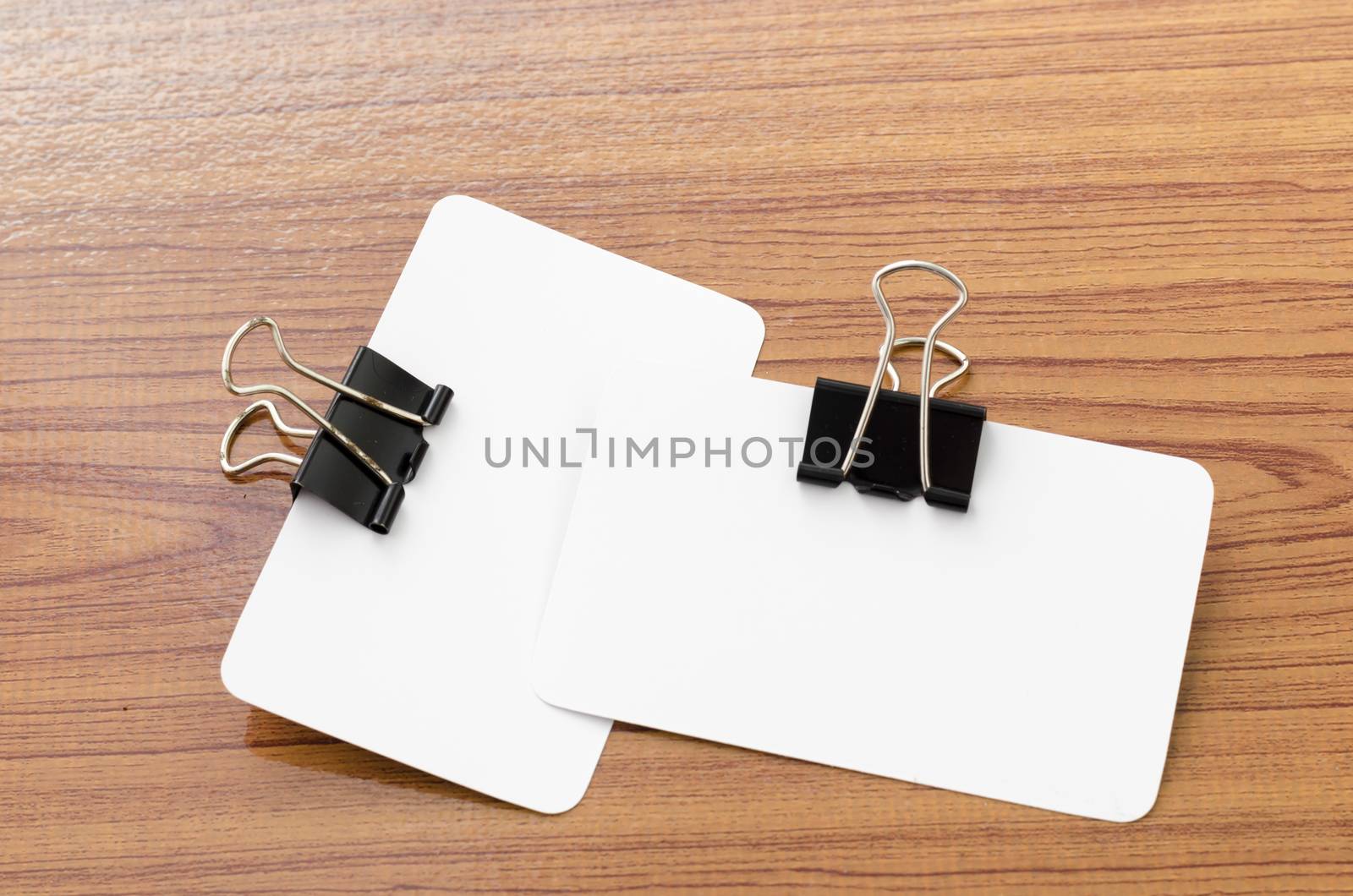 card and clip design on wood background