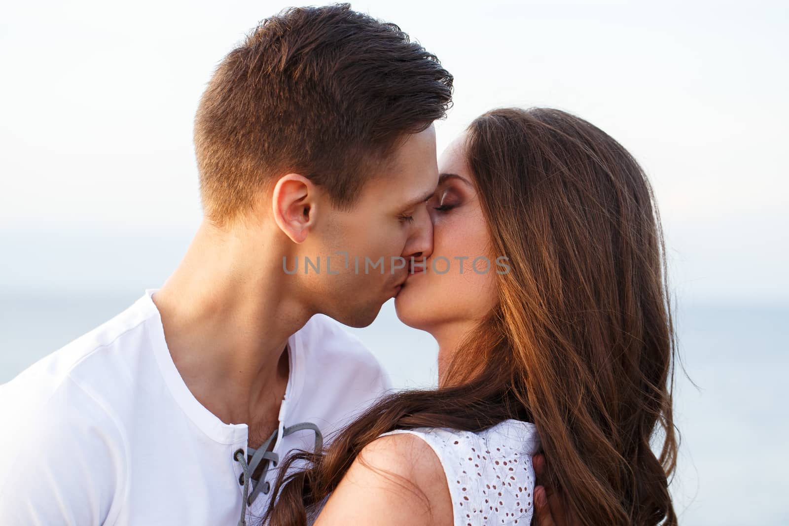 Summer, sea. Cute, lovely couple on the beach