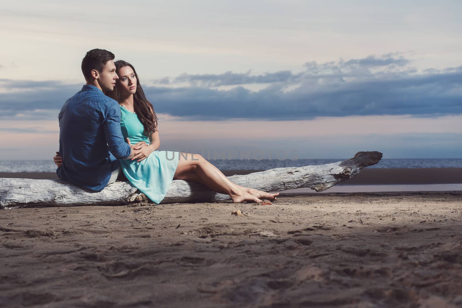 Summer, sea. Cute, lovely couple on the beach