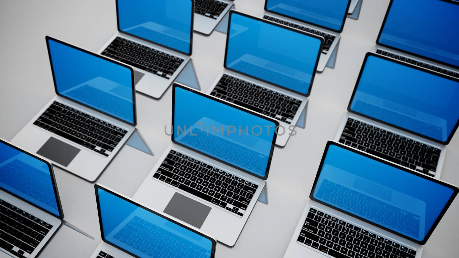 3d image of a lot of laptops in a rows on grey background.