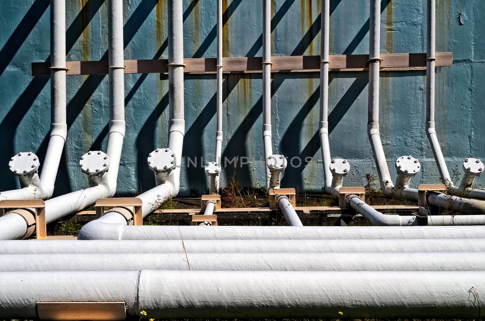 White industrial steel pipes inside a coal power plant