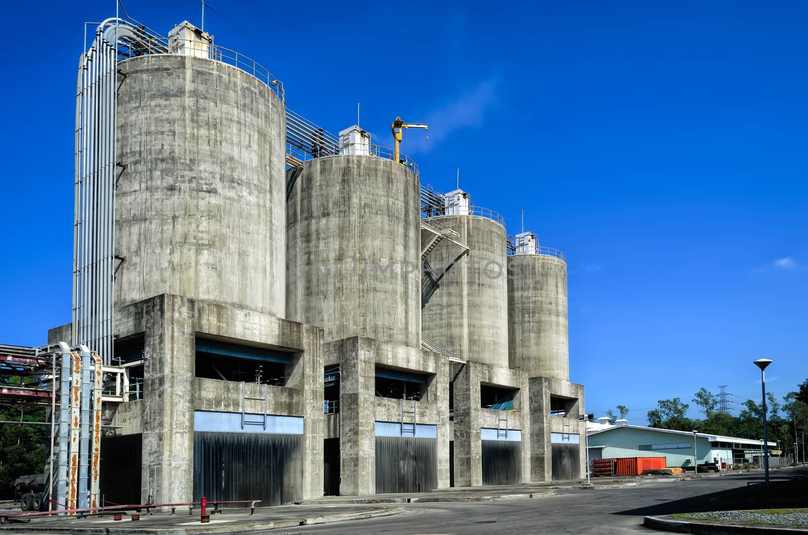 A row of concrete ash silos in power plant