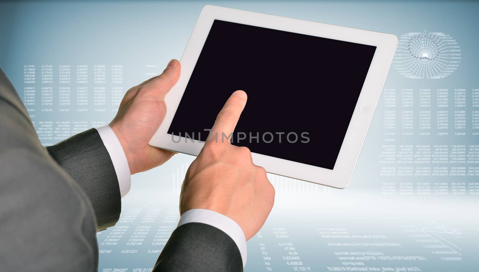 Two hands using tablet pc on hi-tech background