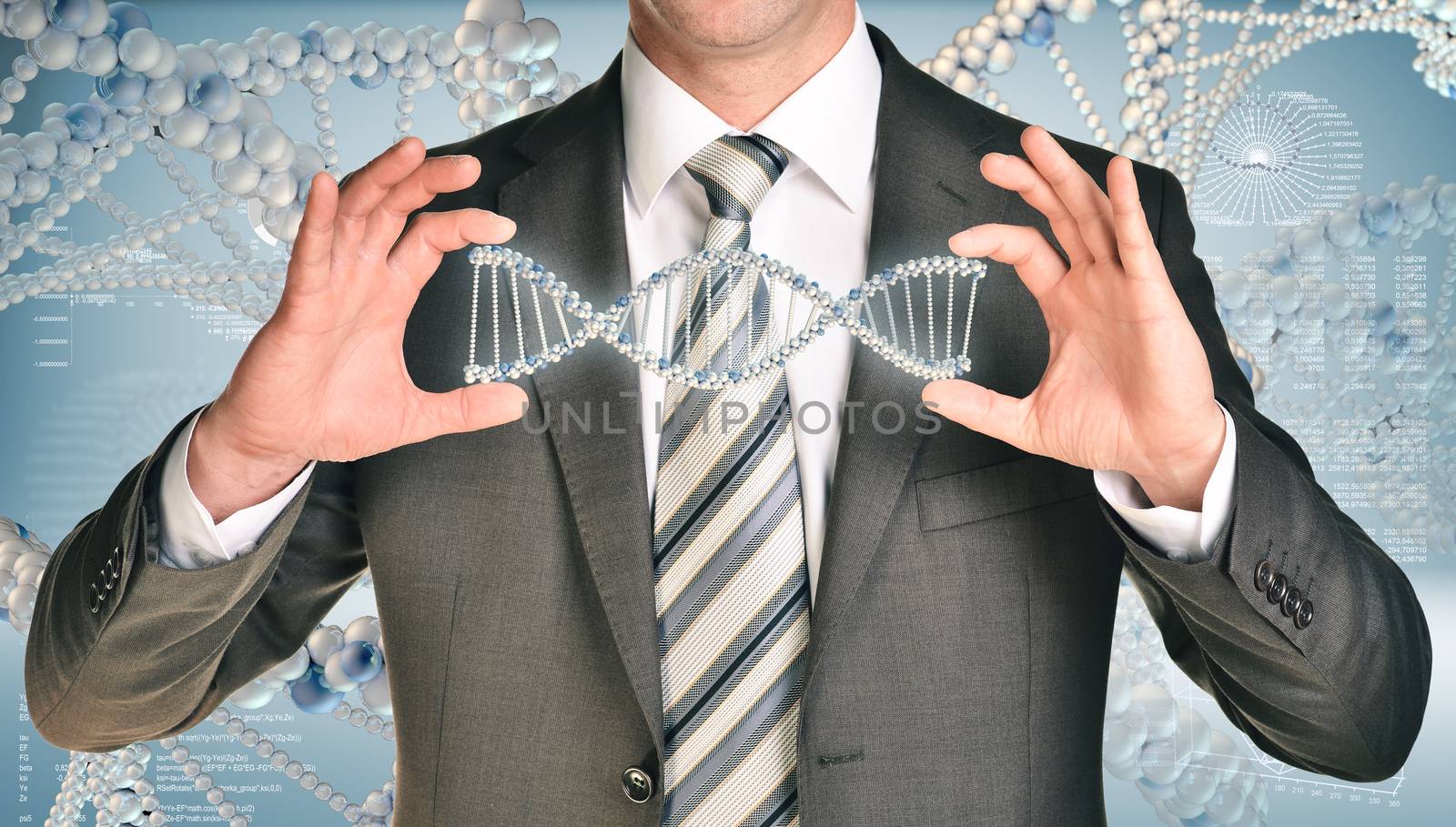 Businessman holding dna spiral in hands. Hi-tech graphs as nackdrop