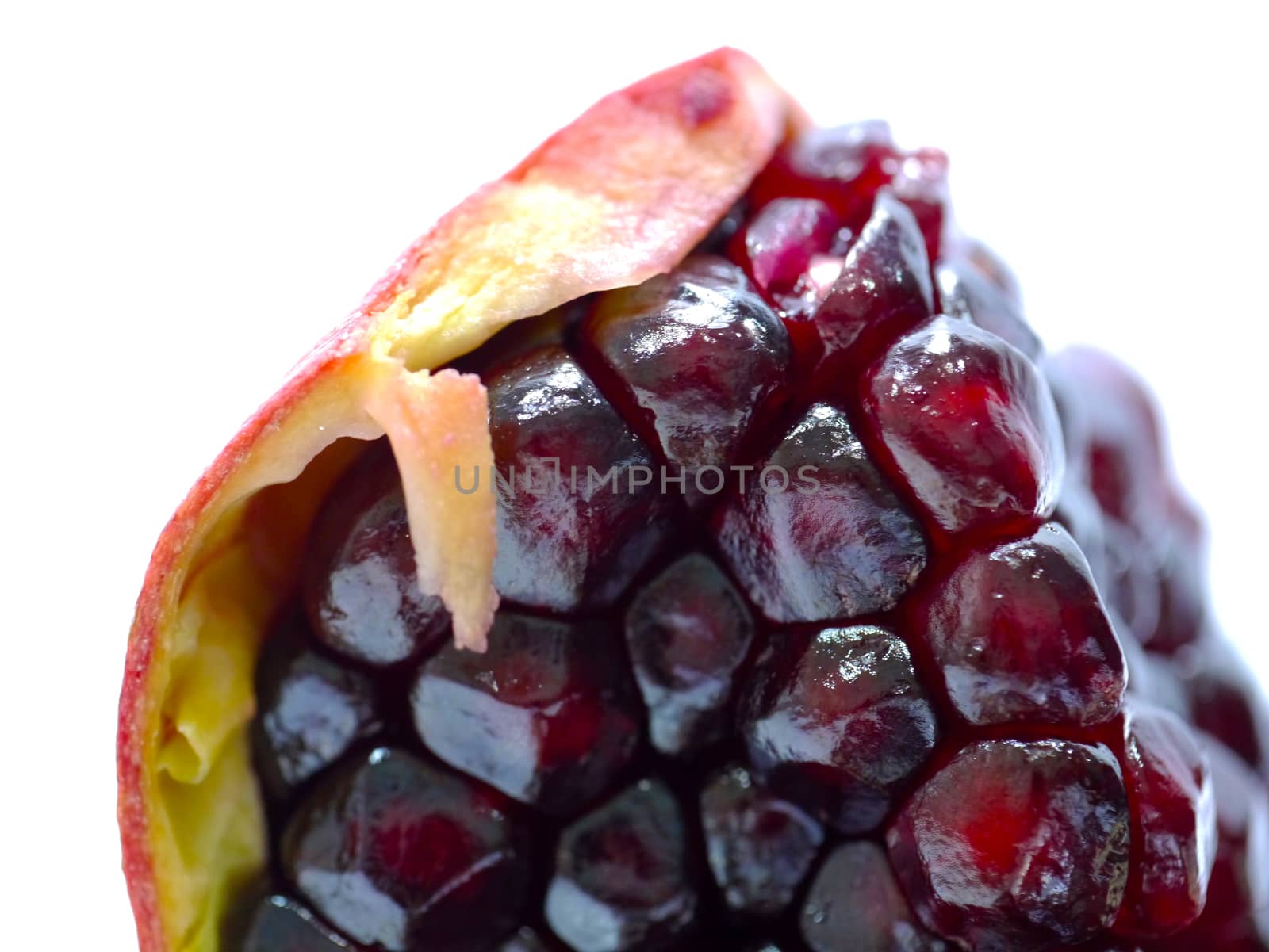 Ripe pomegranate fruit isolated on white background by Noppharat_th