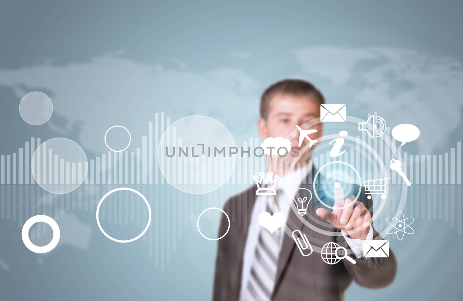 Businessman in suit finger presses virtual button. Graphs as backdrop