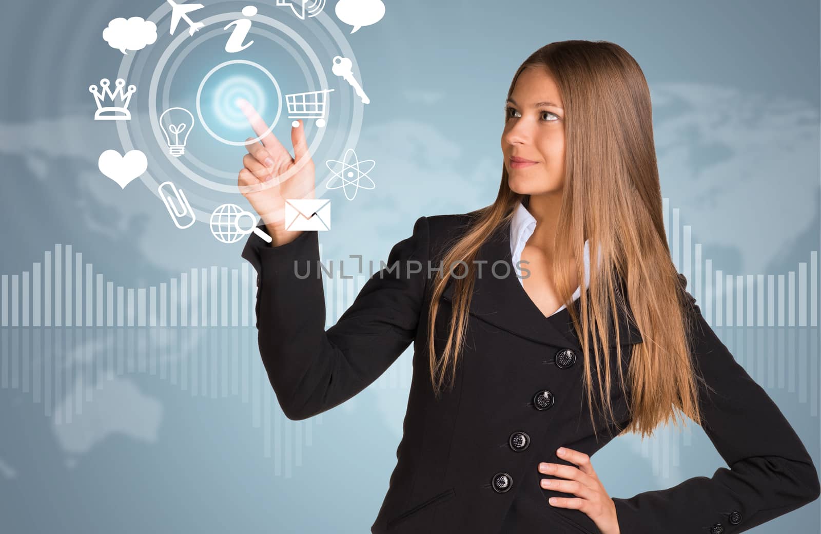 Beautiful businesswoman in suit finger presses virtual button. Graphs as backdrop