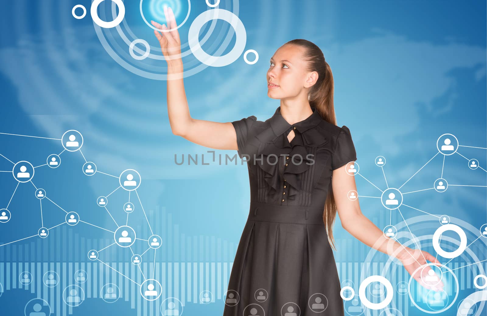 Beautiful businesswoman in dress finger presses virtual button. Graphs as backdrop