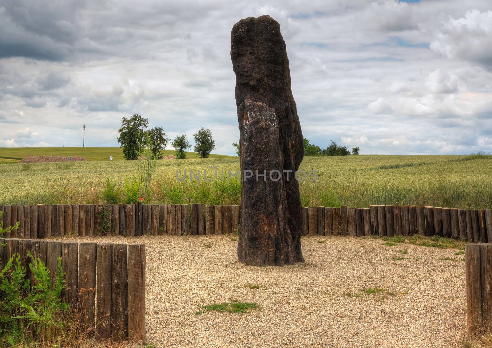 Menhir Stone Shepherd (also Stone Man, Petrified Man or Petrified minister) is a menhir standing alone in a field 1 km northwest of the village Klobuky, district Kladno. This is the highest menhir in the Czech Republic.  3.5 m tall columnar rock uncut dark iron Cretaceous sandstone. This is one of the few stones in the country, which we can with high probability be considered a real prehistoric menhir.